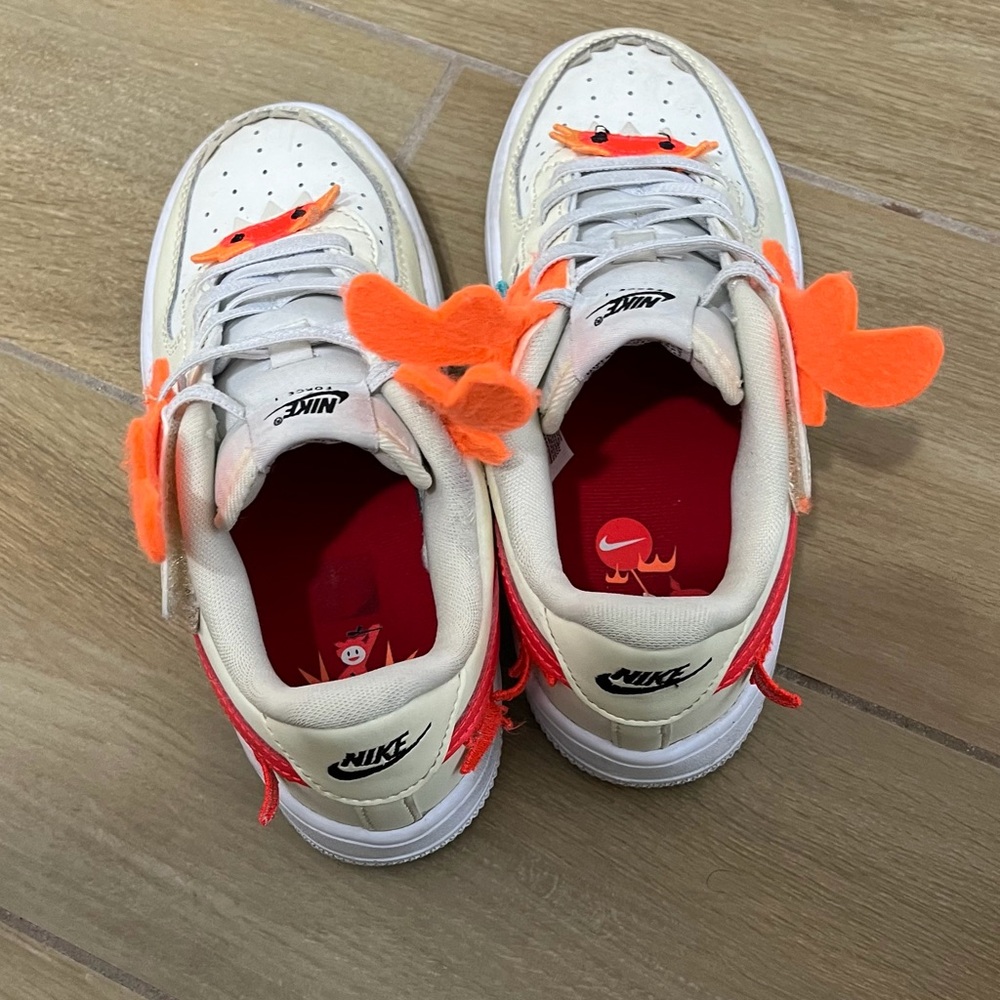 Kids Nike White Sneakers with Bright Orange Details